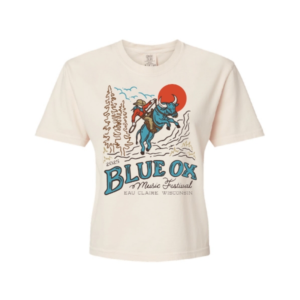 Cream-colored cropped tee with Blue Ox Music Festival 2025 graphic featuring a rider on a blue ox under a red sun