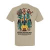 Back of Blue Ox 2025 t-shirt featuring colorful banjo illustration with sun and pine trees with lineup underneath