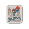 Cowboy riding an ox over Blue Ox text