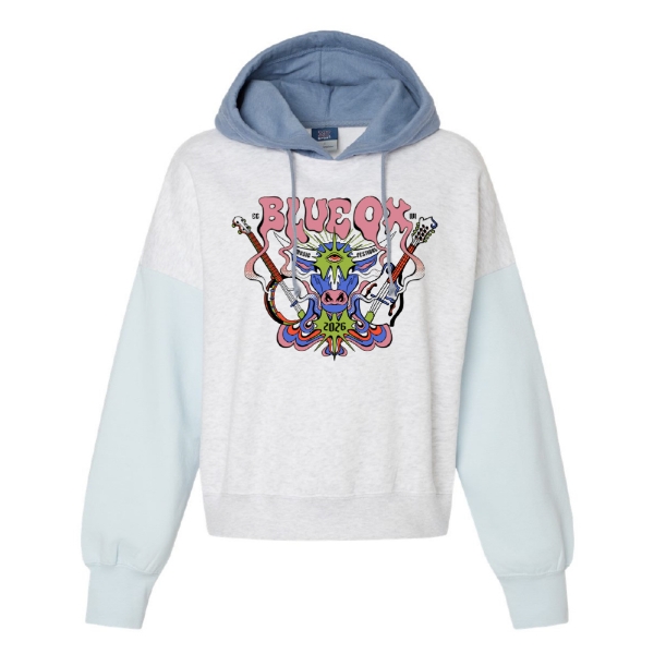 Cropped hoodie with light blue sleeves and hood featuring a psychedelic Blue Ox graphic with guitars and 2026 text.