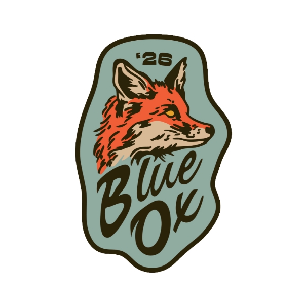Enamel pin shaped like an organic badge featuring a fox illustration and Blue Ox logo with muted green and orange tones